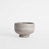 Handmade gray ice cream bowl against a white background.