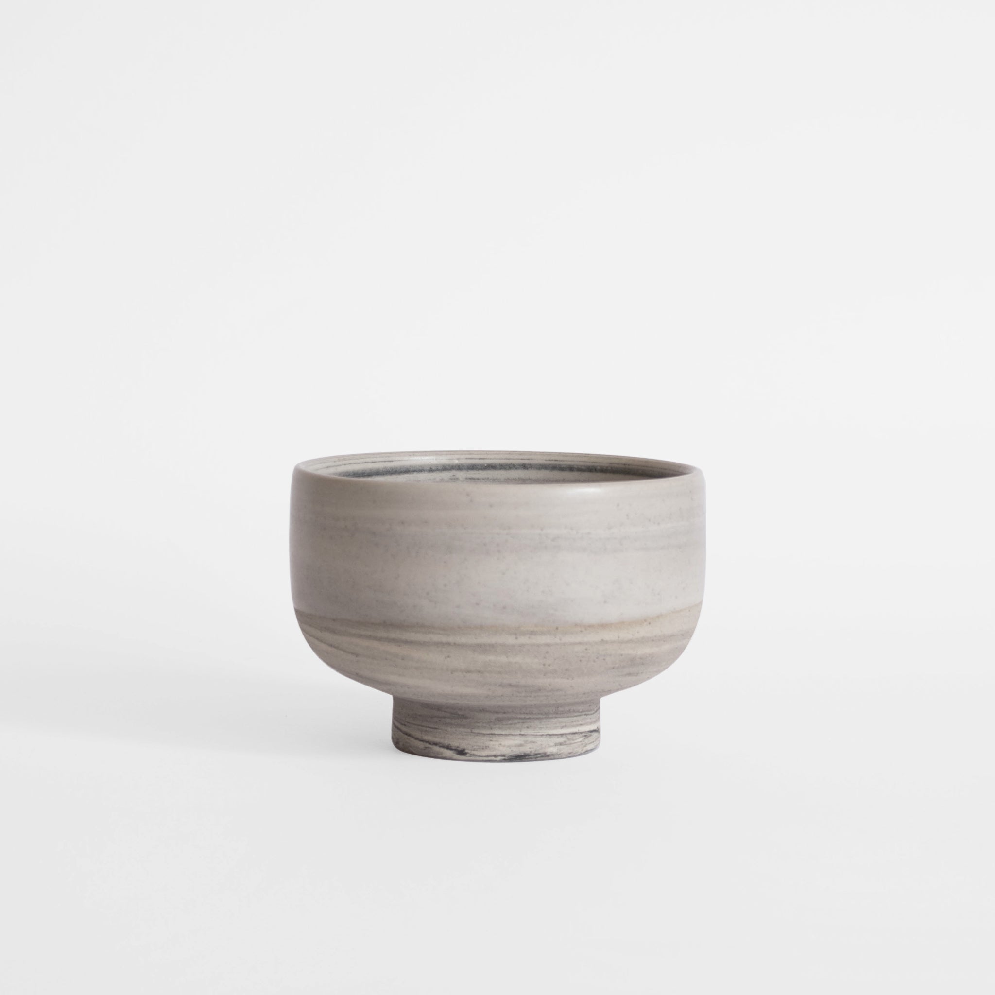 Handmade gray ice cream bowl against a white background.